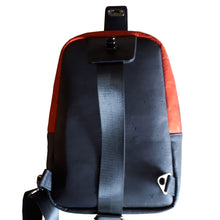 Back of the Ackee 1-2-3 Sling Mini Backpack in black cork, adjustable strap and d-ring hooks, bag by just.a.tad accessories