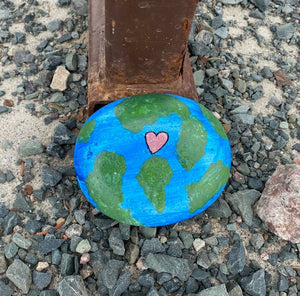 Painted rock of the earth and heart in honour of Earth Day, 2021