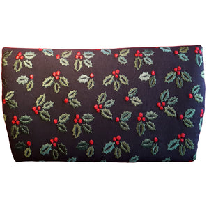 Clutch handbag, view of back of bag in embroidered black linen blend fabric with embroidered green holly leaves and red berries, by just.a.tad accessories, sold by Gems from Paradise.