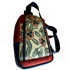 Alternate view of front of the Ackee 1-2-3 Sling Mini Backpack showcasing the ackee print with cork, bag by just.a.tad accessories