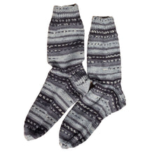 A series of black, grey and white stripes, these Socks by Sandy socks are reminiscent of men's pinstripe suits and are sold by Gems from Paradise.