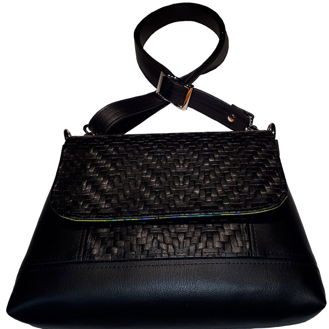 LBB Crossbody bag, front view with flap closure in black basketweave faux leather and adjustable strap, by just.a.tad accessories, sold by Gems from Paradise.