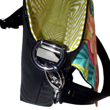 LBB Crossbody bag, side view of shiny nickel strap anchor, interior lining in chartreuse and cream geometric print, by just.a.tad accessories, sold by Gems from Paradise.