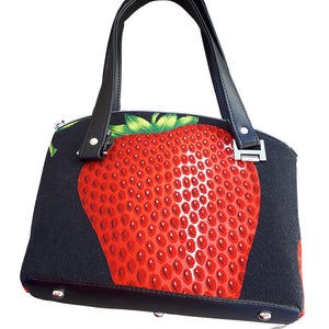 Domed handbag in Alexander Henry's "Very Strawberry" fabric and black vinyl bottom, by just.a.tad accessories, sold by Gems from Paradise.