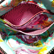 View of bag interior pockets featuring Tula Pink's Kabloom floral print and Lazy Stripe print, by just.a.tad accessories, sold by Gems from Paradise.