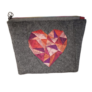 Zip Pouch front view of FPP heart in pinks & magenta with charcoal linen cotton background fabric, heart zipper pull, by just.a.tad accessories, sold by Gems from Paradise.